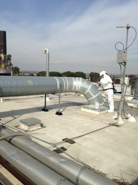Airtek worker fixing an air duct system