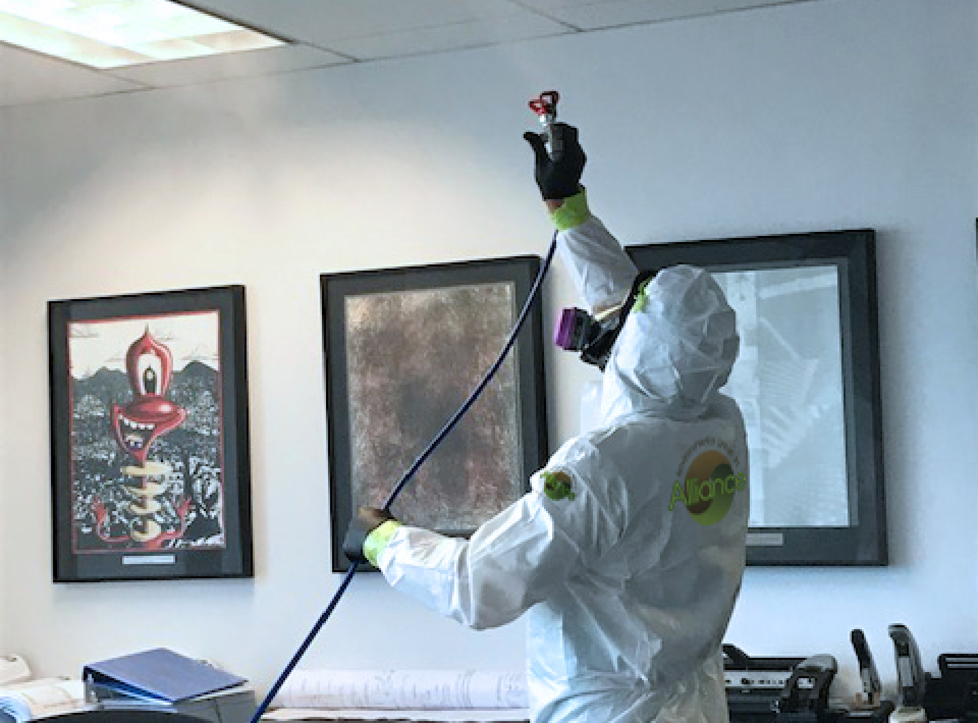 Alliance worker using a BioHazard spray