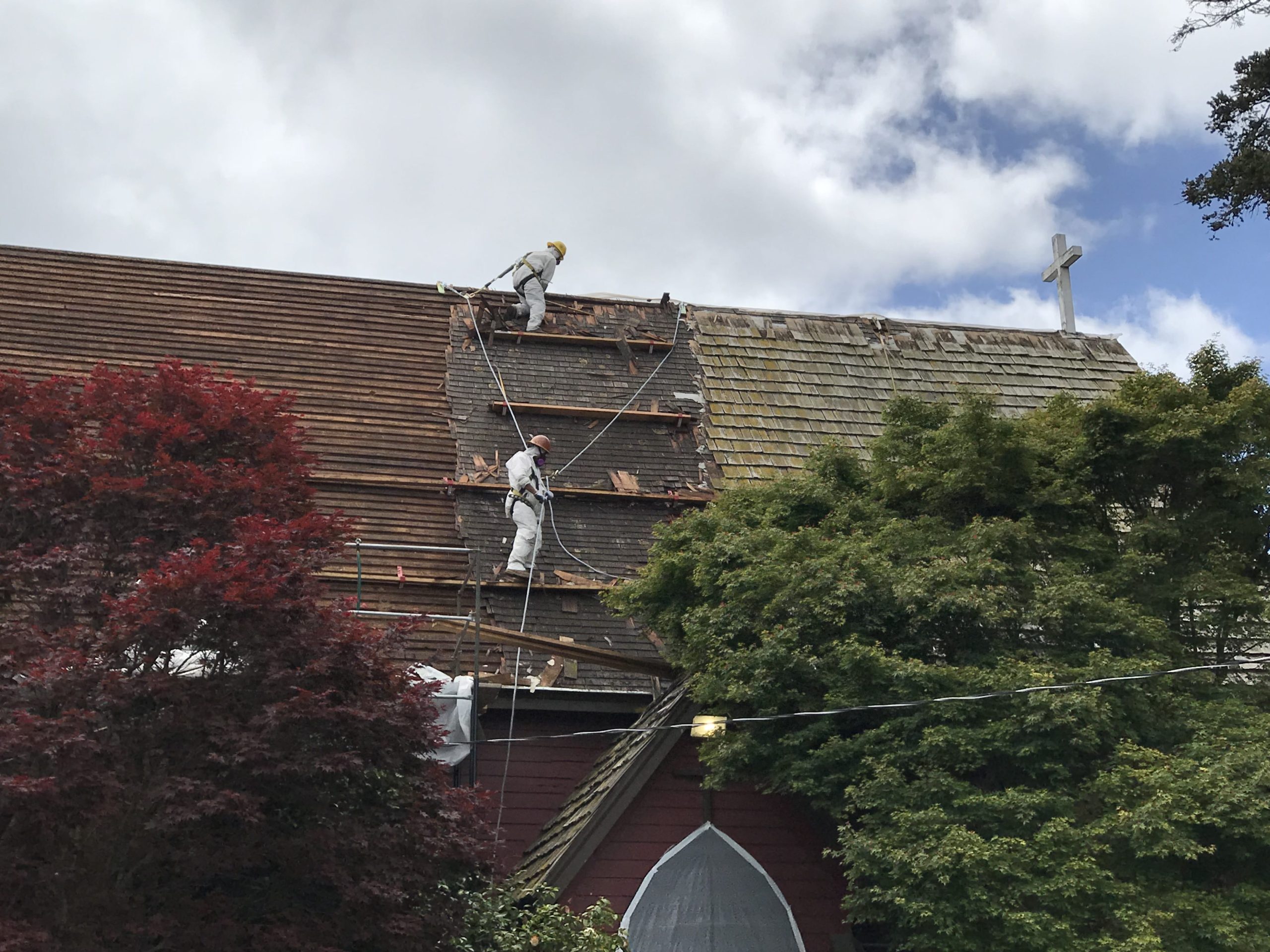Asbestos Abatement - Workers removing roofing tiles