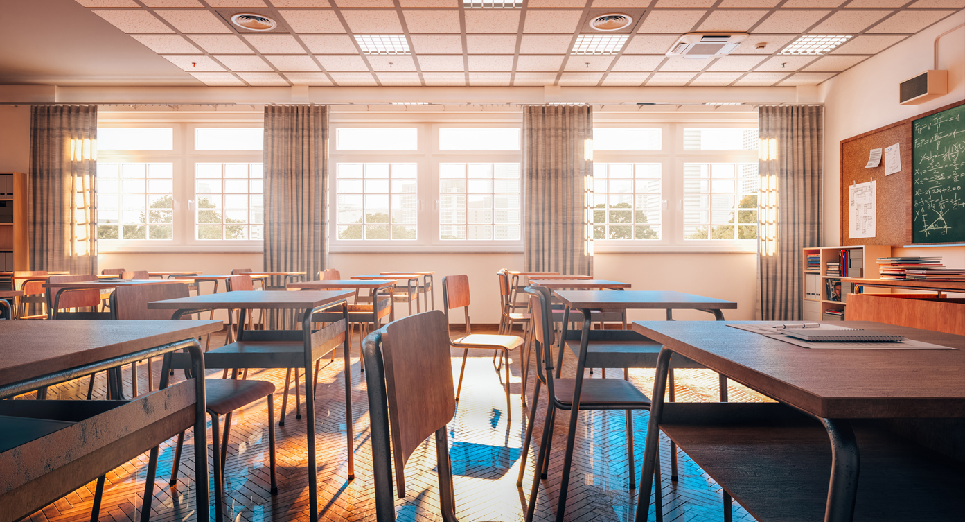 school classroom with wooden floor and furniture